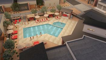 an aerial view of a pool and patio area with lounge chairs and umbrellas